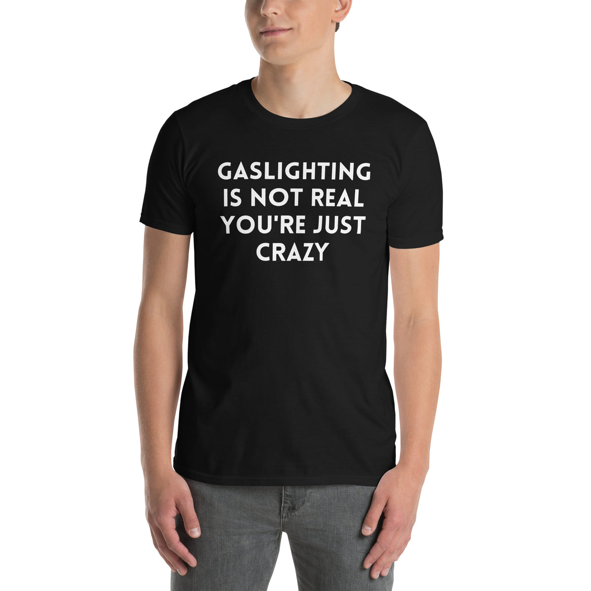Black unisex t-shirt with "Gaslighting Is Not Real You're Just Crazy" graphic print, front view